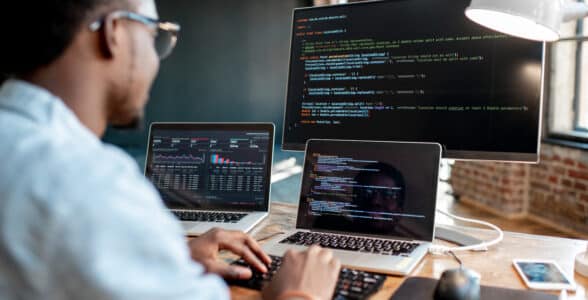 IT employee analysing computer code